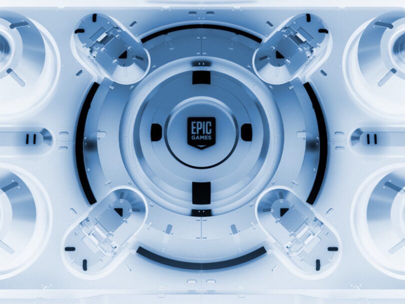 Visuel promotionnel futuriste de l'Epic Games Store présentant le logo central dans un design technologique blanc et bleu, illustrant l'annonce des jeux mystères gratuits de mai 2026.