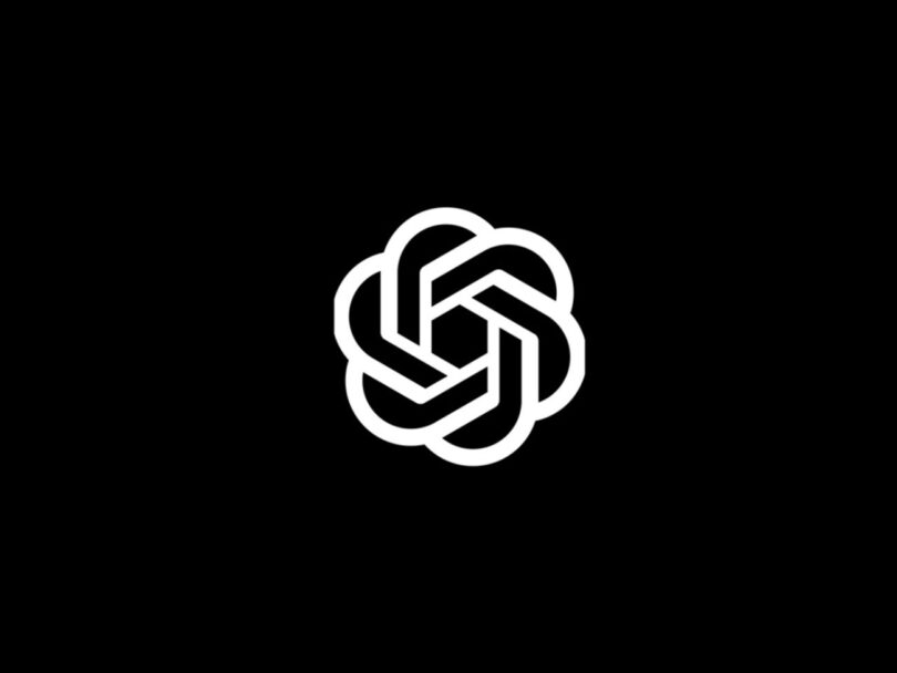 Logo officiel d'OpenAI blanc sur fond noir, illustrant l'annonce des trois nouveaux modèles d'API audio temps réel pour les interactions vocales à basse latence.